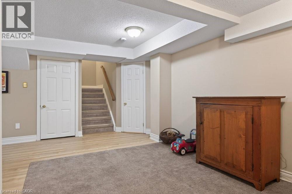 Updated flooring in finished basement - 100 Beddoe Drive Unit# 101, Hamilton, ON - Indoor