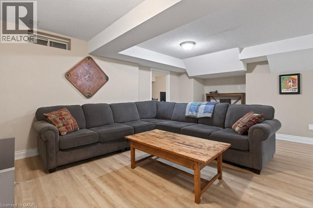 updated flooring in Rec room - 100 Beddoe Drive Unit# 101, Hamilton, ON - Indoor Photo Showing Living Room