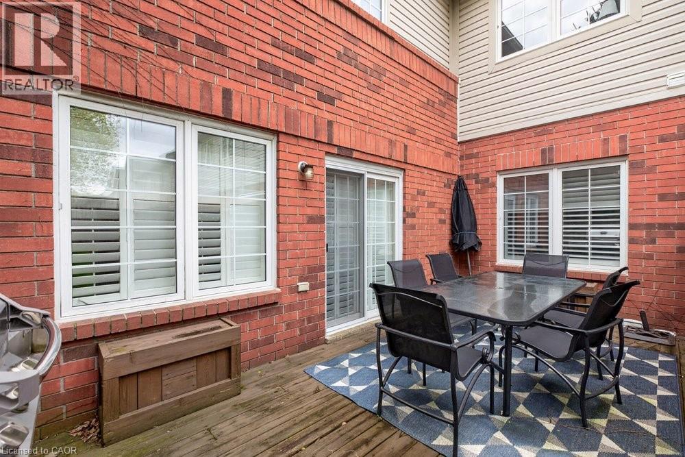 Living room walkout to deck & privacy fencing - 100 Beddoe Drive Unit# 101, Hamilton, ON - Outdoor With Deck Patio Veranda With Exterior