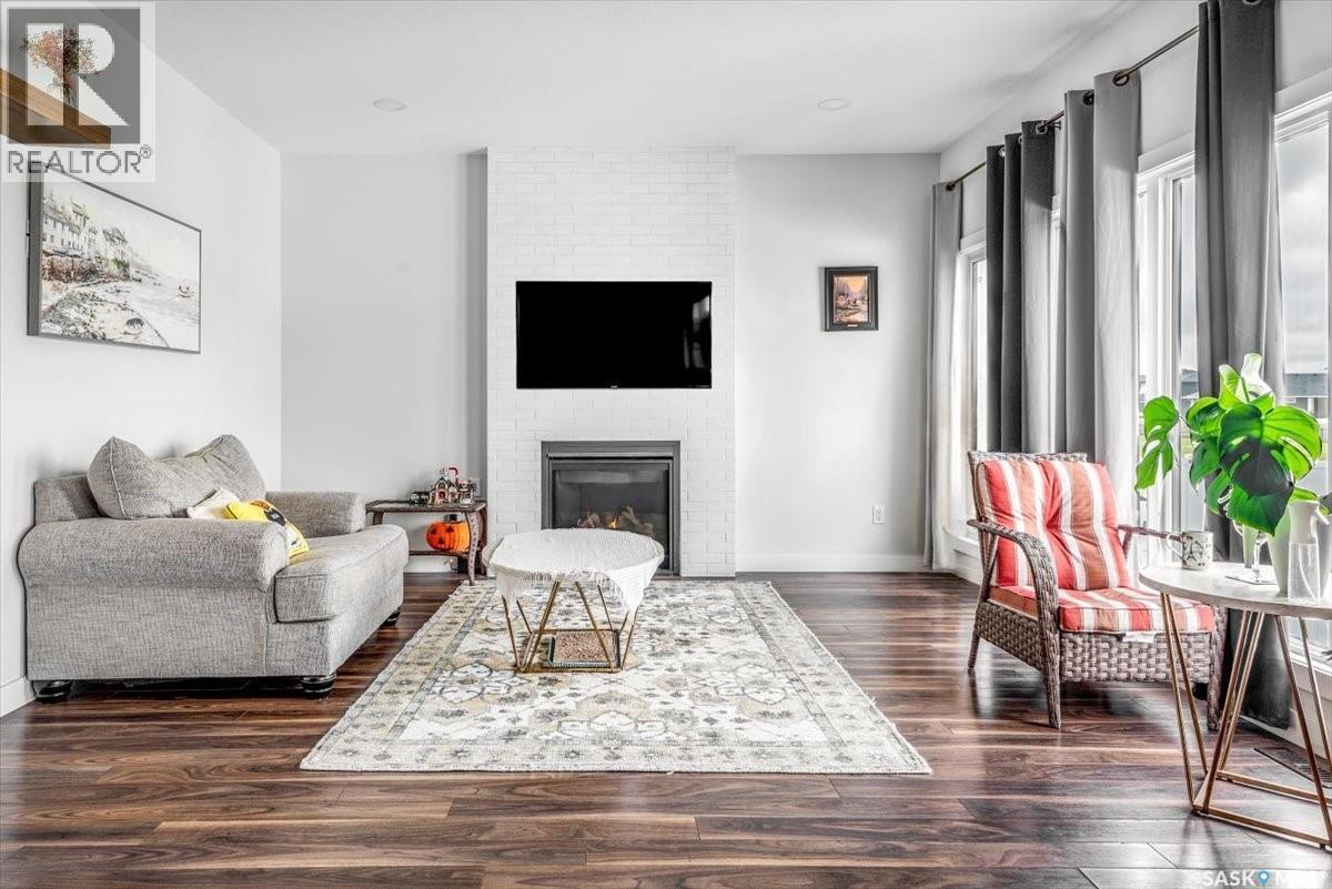 3628 Gee Crescent, Regina, SK - Indoor Photo Showing Living Room With Fireplace