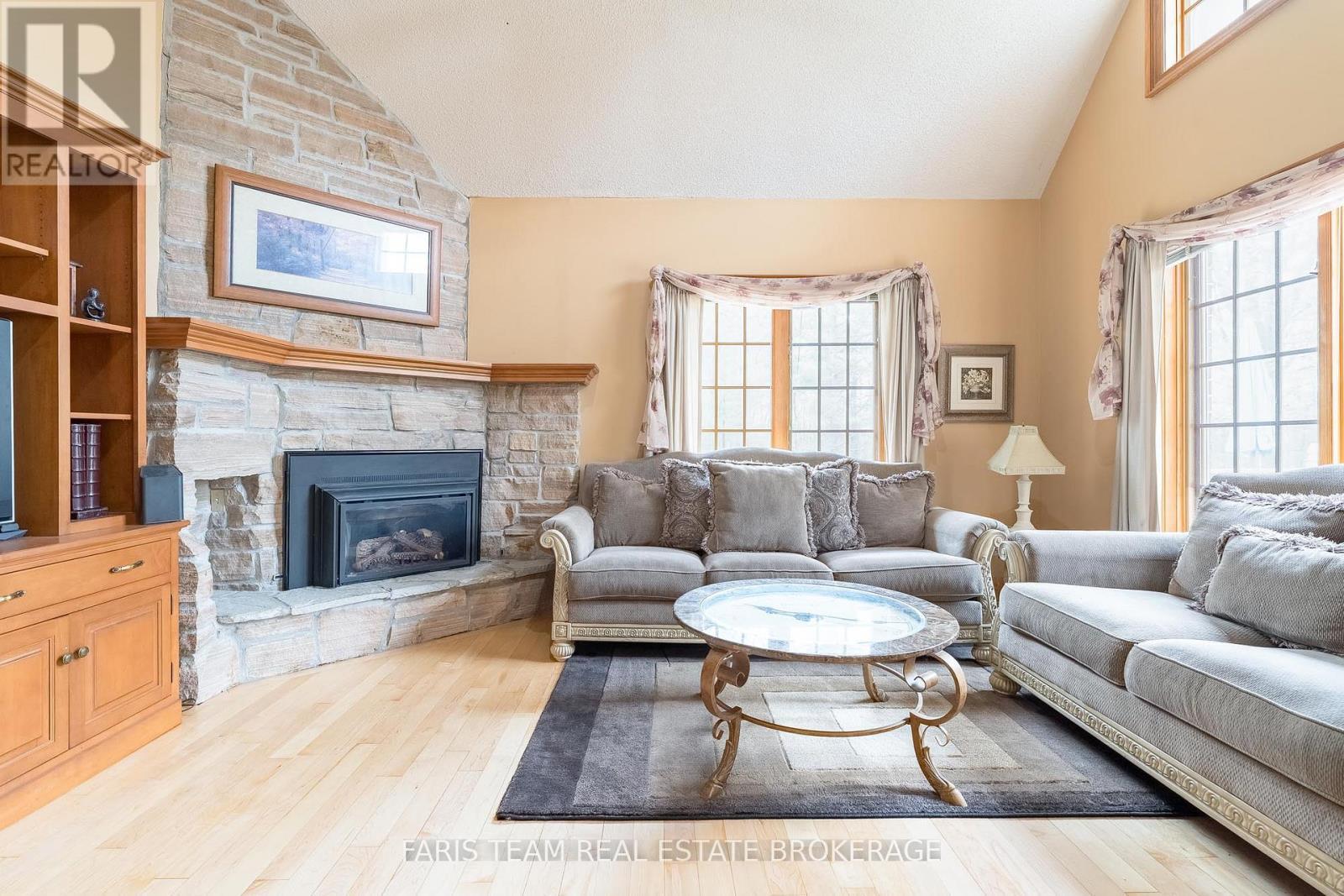 4 Mills Circle, Springwater, ON - Indoor Photo Showing Living Room With Fireplace