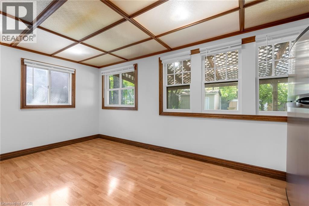 Room featuring wood-finish flooring, white walls, and a wood-beamed coffered ceiling - 168 Britannia Avenue, Hamilton, ON - Indoor Photo Showing Other Room