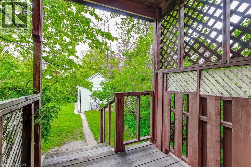 Covered porch with wood-finish flooring and lattice panels - 18 Fairleigh Crescent, Hamilton, ON - Outdoor With Deck Patio Veranda With Exterior