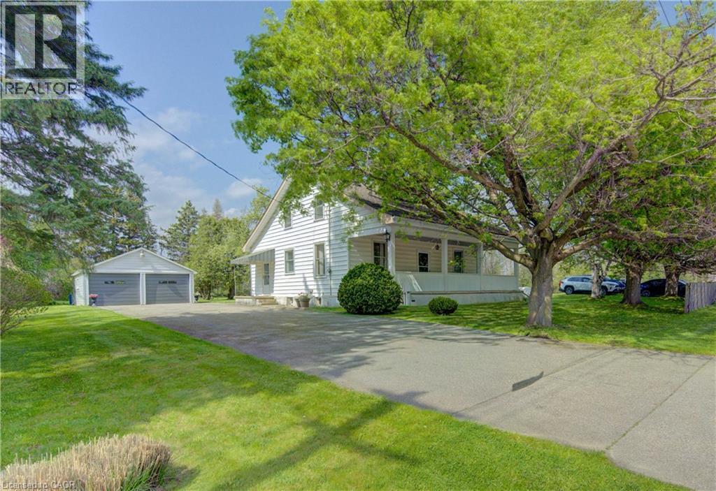 White siding residence with a covered porch - 1463 Kossuth Road, Cambridge, ON - Outdoor