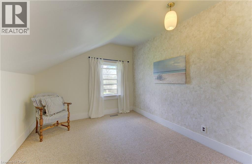 Room featuring light-toned carpeting and sloped ceilings - 1463 Kossuth Road, Cambridge, ON - Indoor Photo Showing Other Room