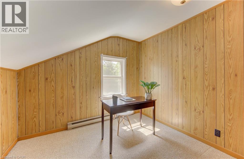Room with light wood-finish paneled walls, white ceiling, and a single window - 1463 Kossuth Road, Cambridge, ON - Indoor Photo Showing Office