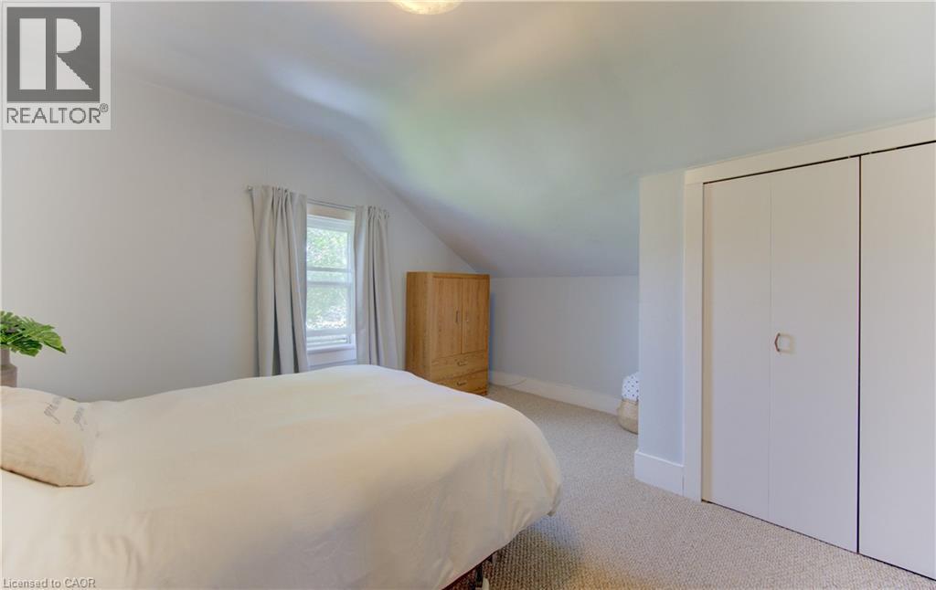 Bedroom with sloped ceilings and light gray carpeting - 1463 Kossuth Road, Cambridge, ON - Indoor Photo Showing Bedroom