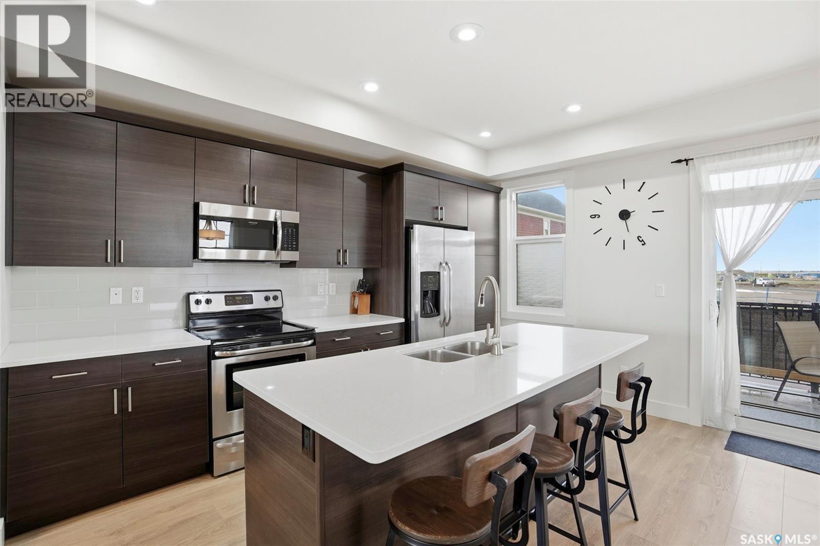 737 Meadows Boulevard, Saskatoon, SK - Indoor Photo Showing Kitchen With Stainless Steel Kitchen With Double Sink With Upgraded Kitchen