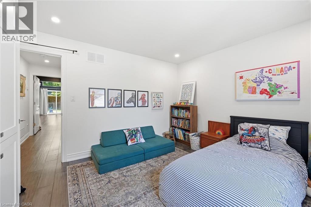 Bright room featuring recessed lighting, white walls, and wood-finish flooring - 24 Glenwood Crescent, Hamilton, ON - Indoor Photo Showing Bedroom