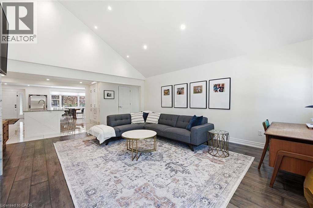 Living area with vaulted ceilings and recessed lighting - 24 Glenwood Crescent, Hamilton, ON - Indoor Photo Showing Living Room