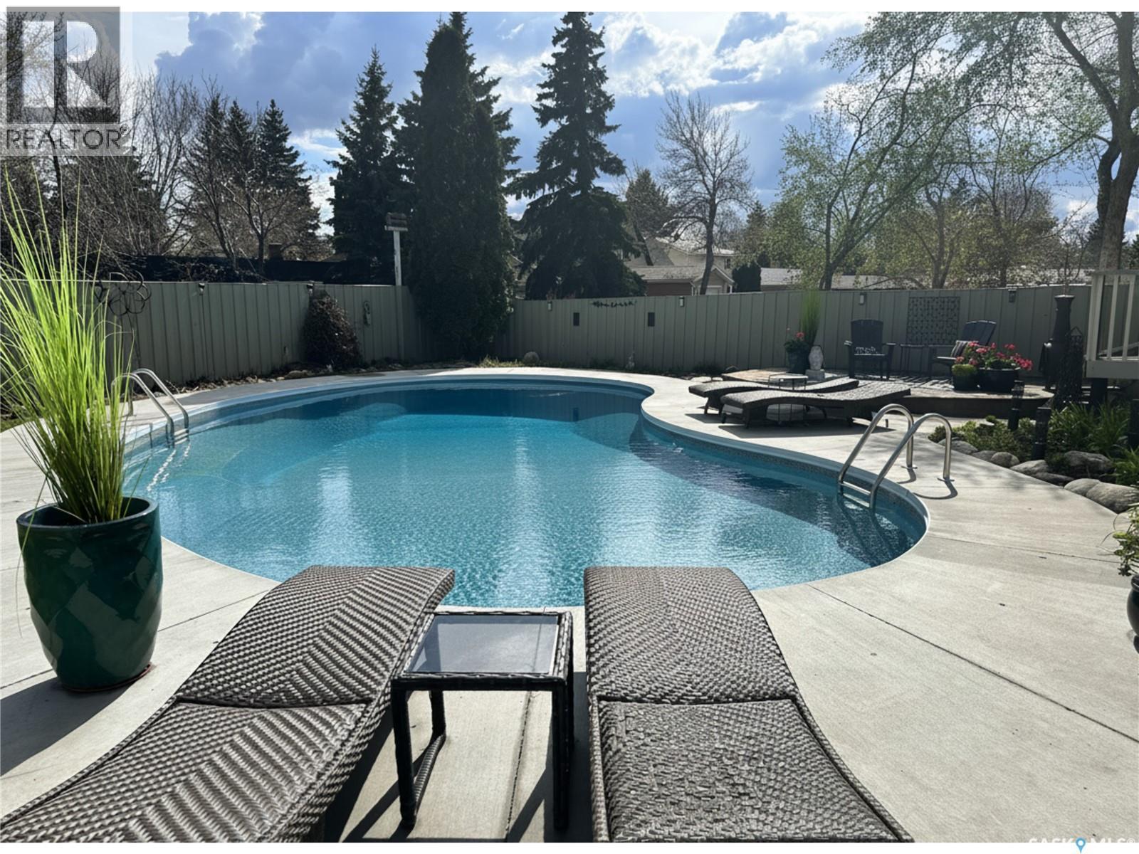 30 Cambridge Crescent, Saskatoon, SK - Outdoor With In Ground Pool With Backyard