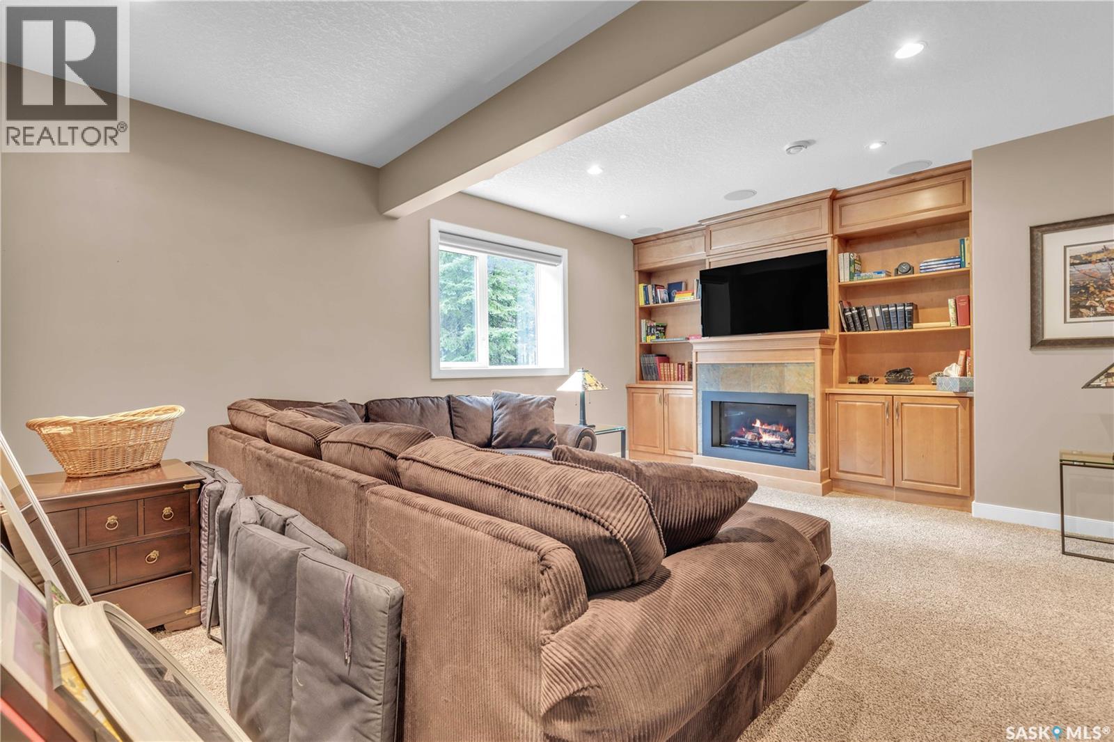 #26 Estates Drive, Elk Ridge, SK - Indoor Photo Showing Living Room With Fireplace