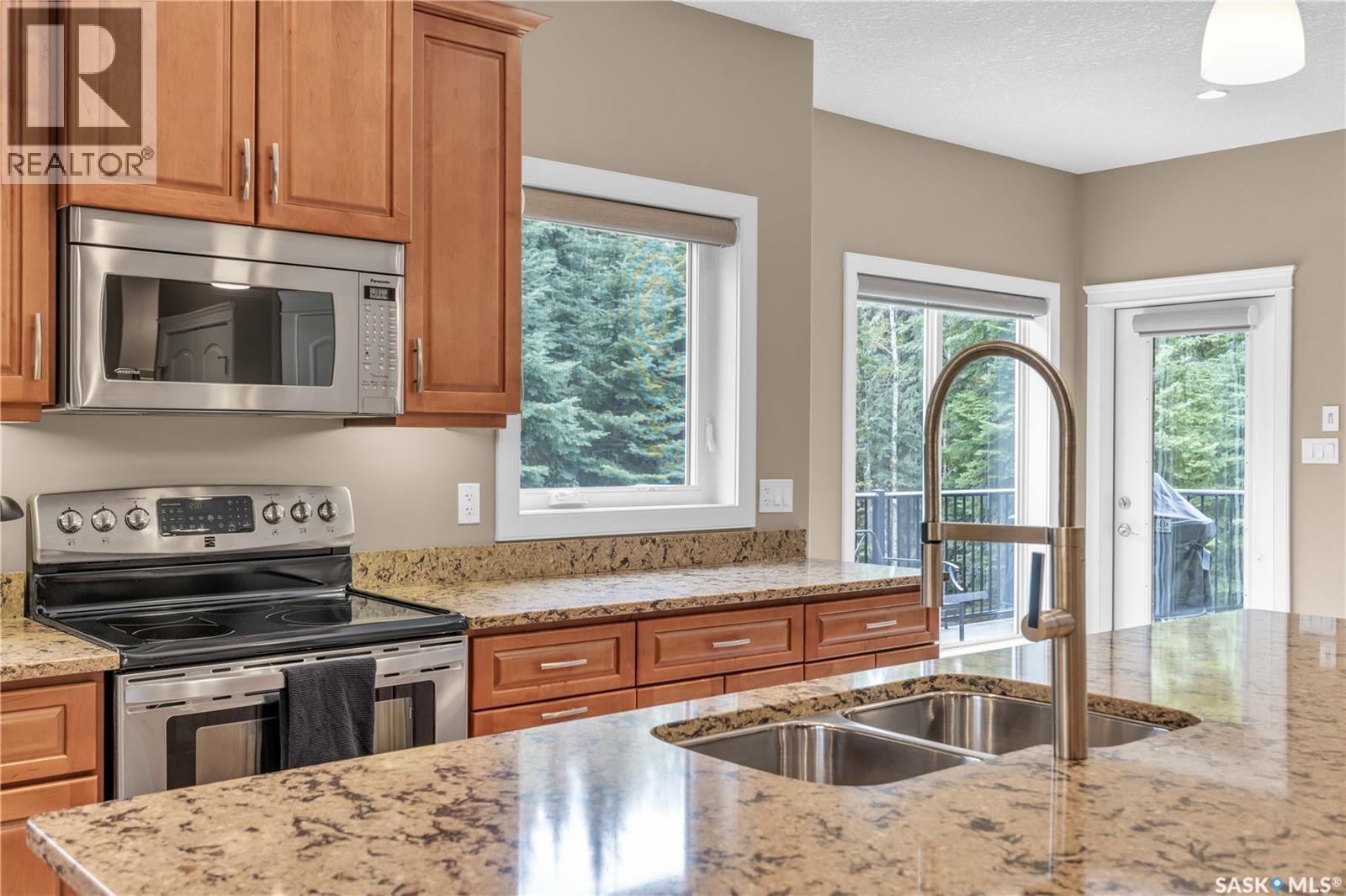 #26 Estates Drive, Elk Ridge, SK - Indoor Photo Showing Kitchen With Stainless Steel Kitchen With Double Sink