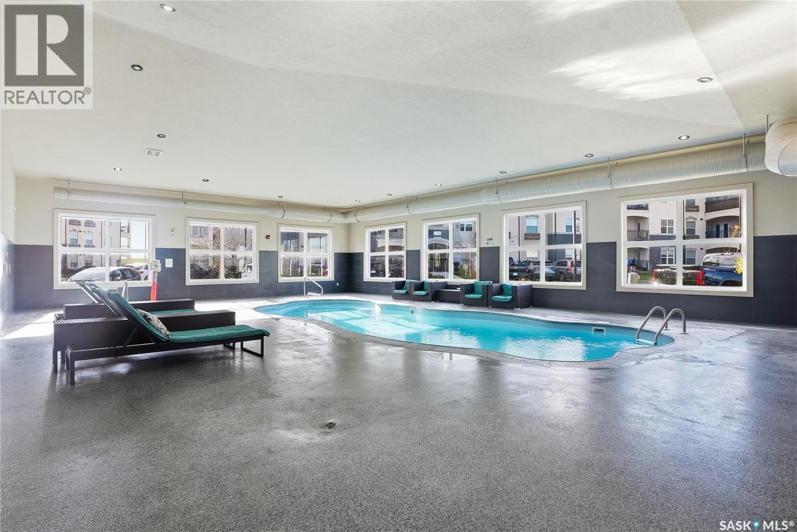 107 130 Phelps Way, Saskatoon, SK - Indoor Photo Showing Other Room With In Ground Pool