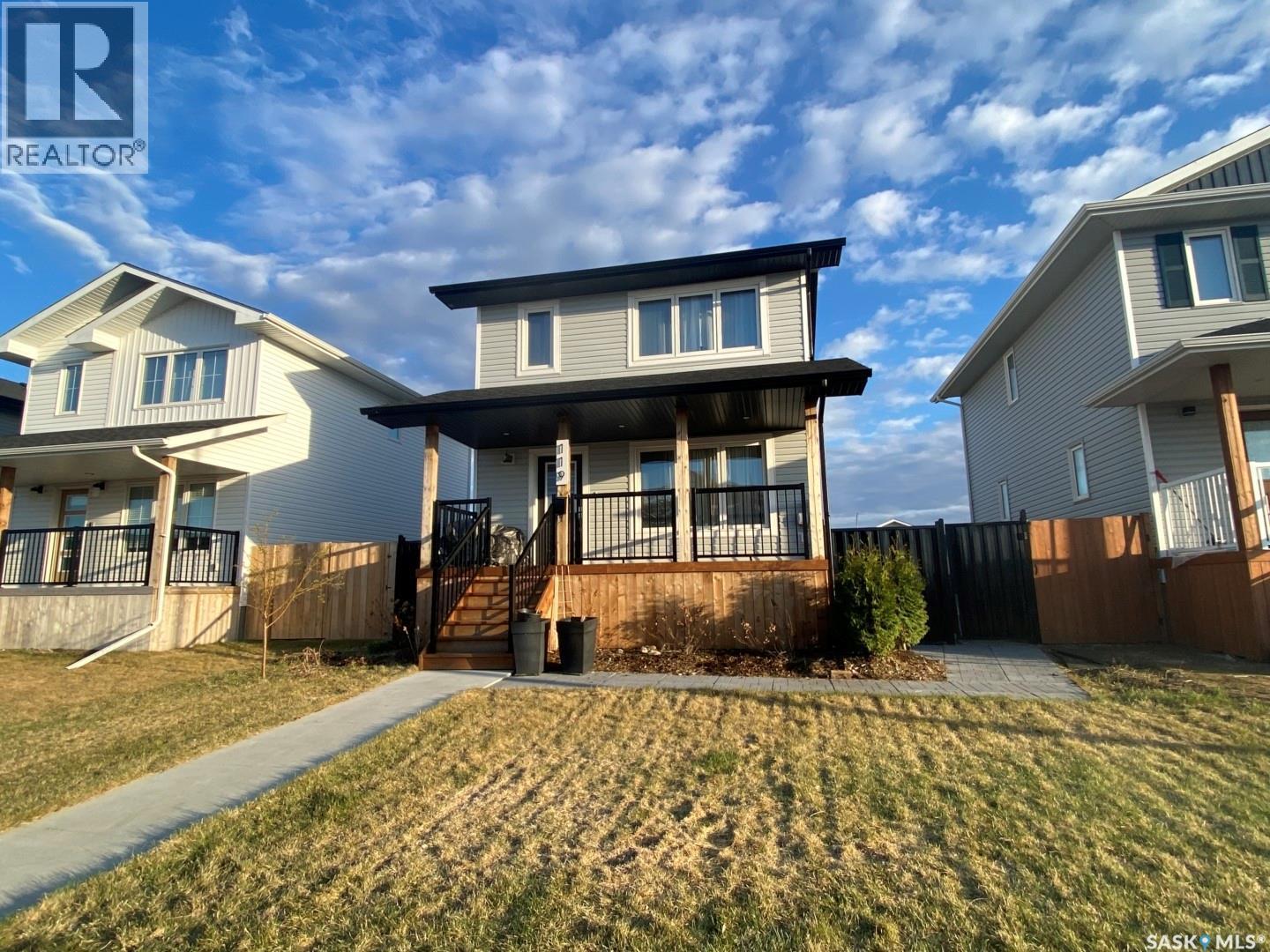 119 Reddekopp Crescent, Warman, SK - Outdoor With Deck Patio Veranda With Facade