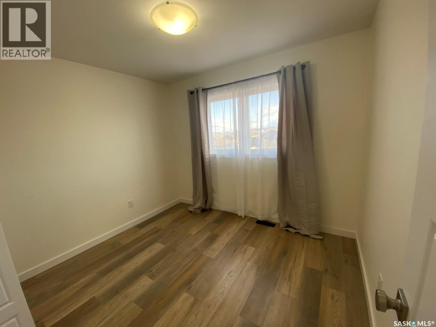119 Reddekopp Crescent, Warman, SK - Indoor Photo Showing Other Room
