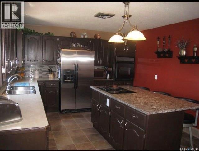 1101 109Th Avenue, Tisdale, SK - Indoor Photo Showing Kitchen With Double Sink