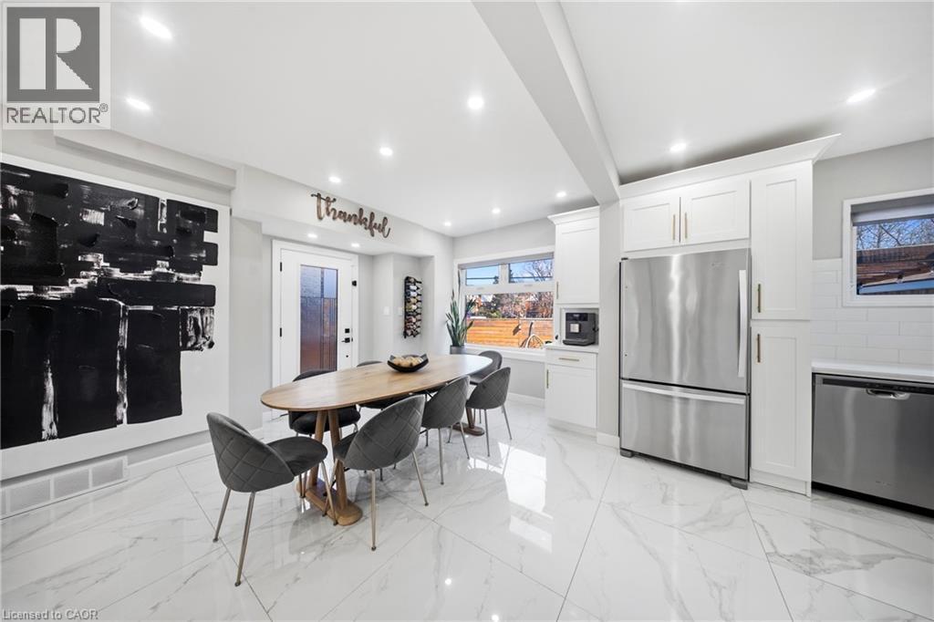 Dining area featuring beam ceiling, recessed lighting, and light marble finish flooring - 273 Stinson Crescent, Hamilton, ON - Indoor