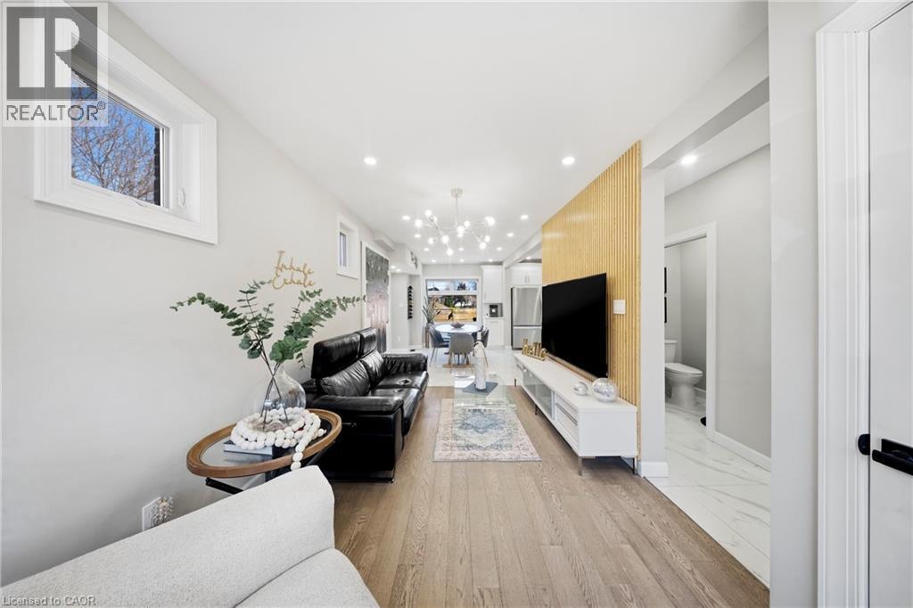 Living room with recessed lighting and light wood-style flooring - 273 Stinson Crescent, Hamilton, ON - Indoor