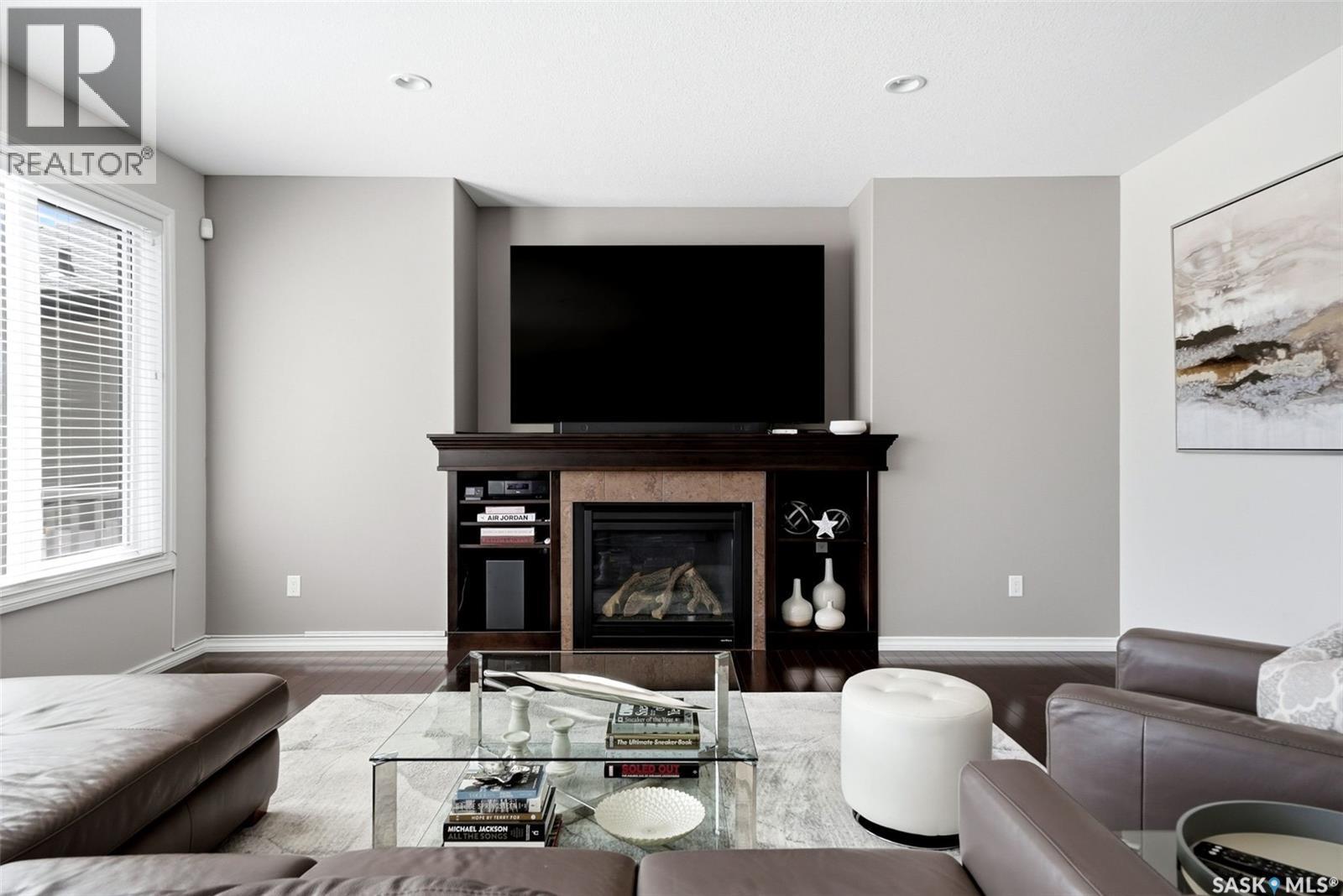 141 Oxbow Crescent, Regina, SK - Indoor Photo Showing Living Room With Fireplace