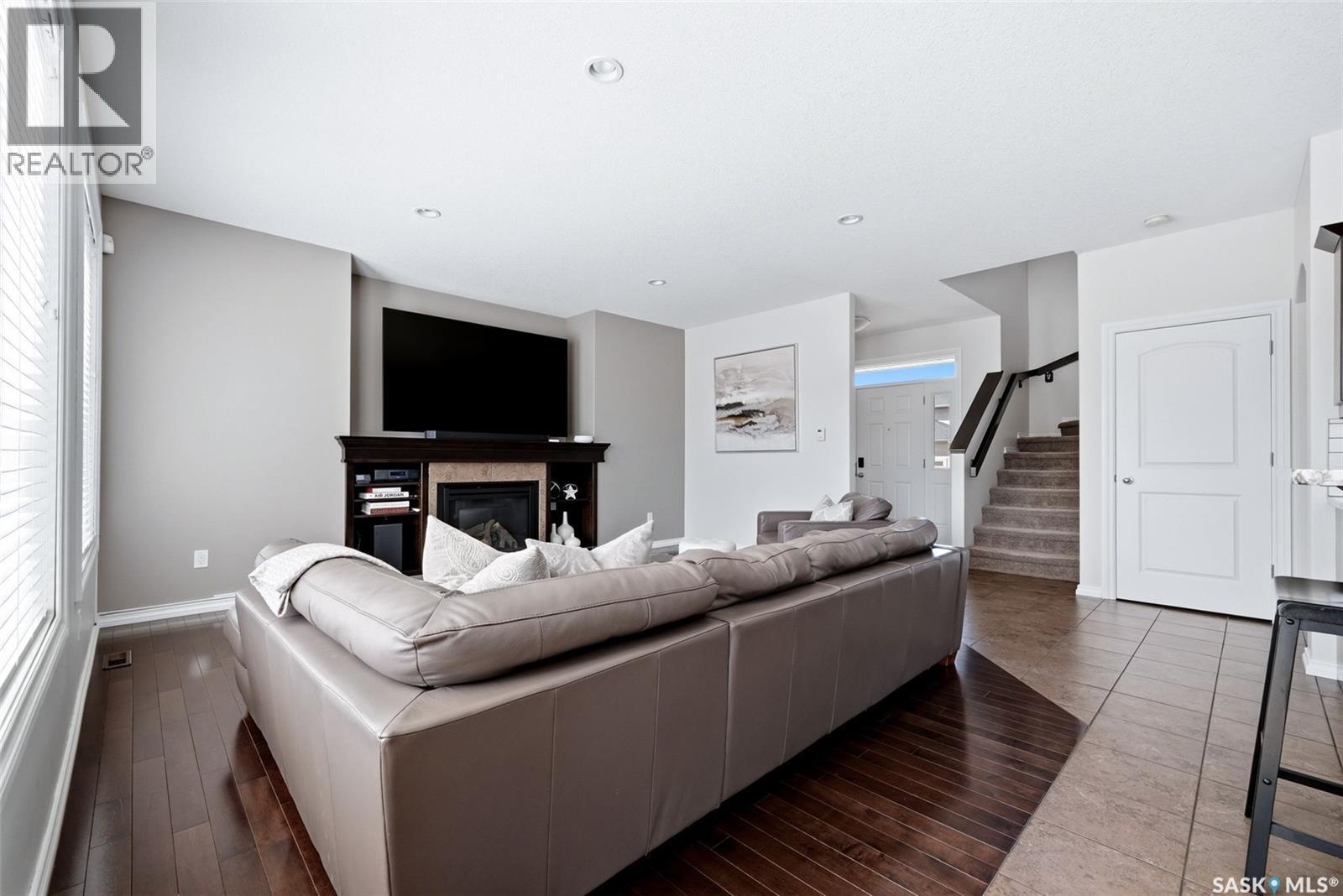 141 Oxbow Crescent, Regina, SK - Indoor Photo Showing Other Room With Fireplace
