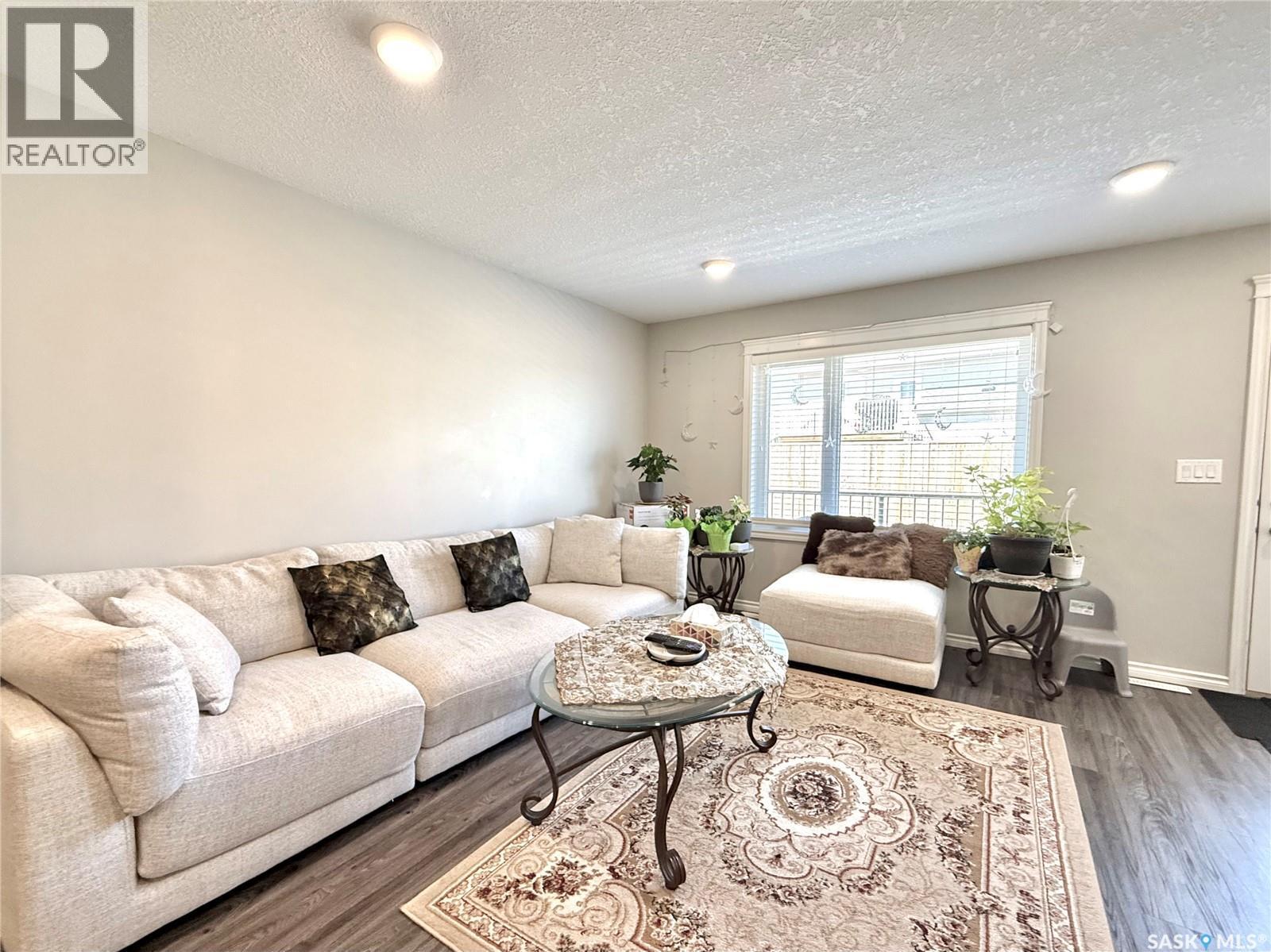 503 110 Akhtar Bend, Saskatoon, SK - Indoor Photo Showing Living Room