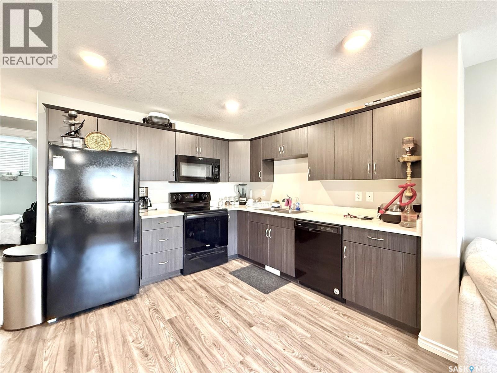 503 110 Akhtar Bend, Saskatoon, SK - Indoor Photo Showing Kitchen With Double Sink