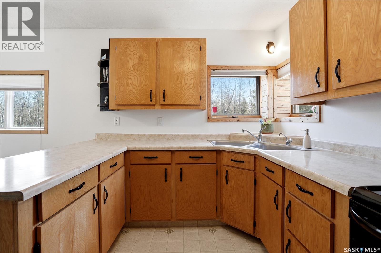 123 Burberry Road, Christopher Lake, SK - Indoor Photo Showing Kitchen With Double Sink