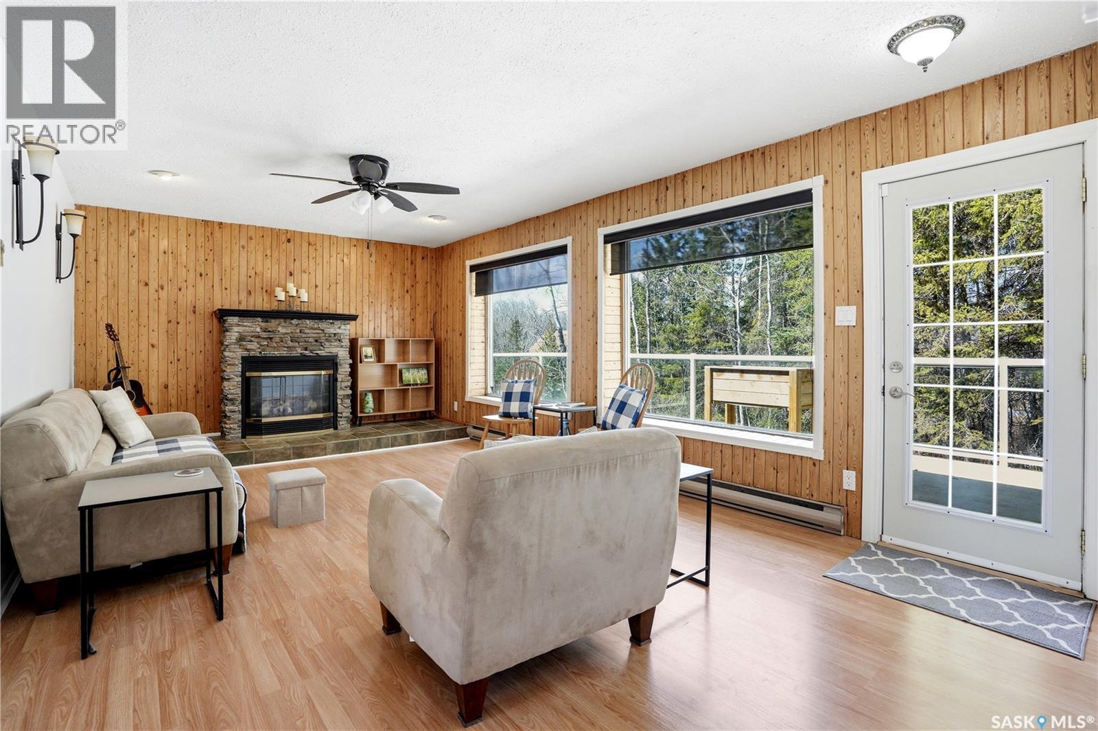 123 Burberry Road, Christopher Lake, SK - Indoor Photo Showing Living Room With Fireplace