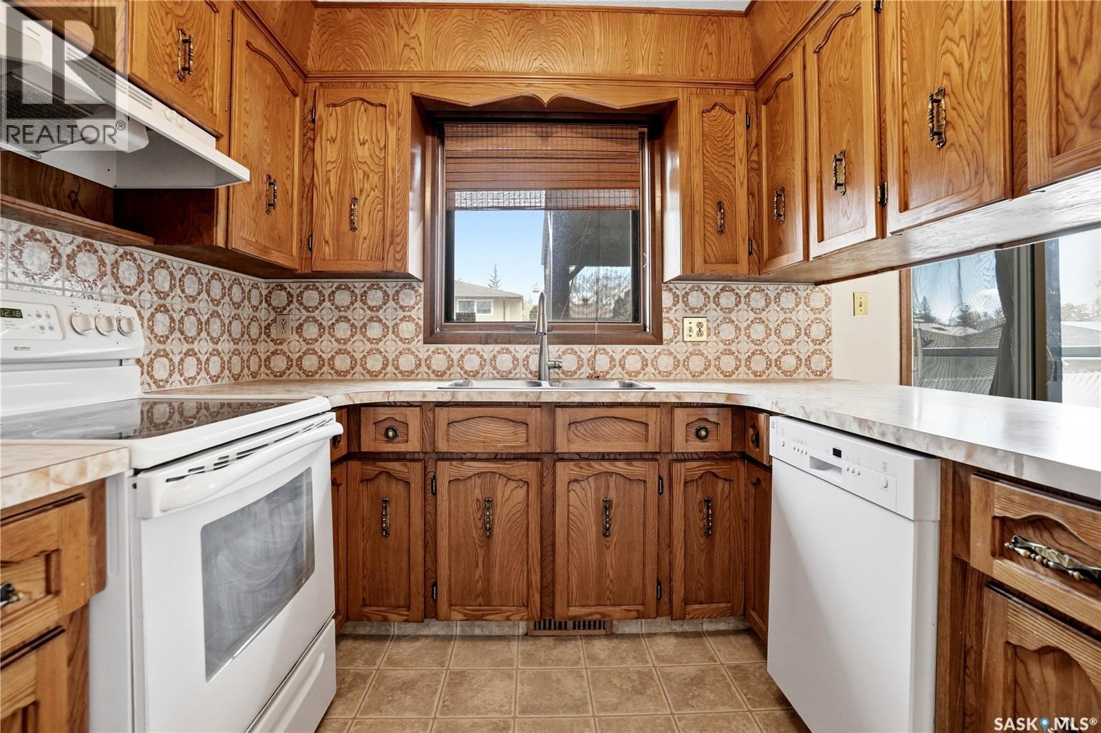 43 Springstein Avenue, Regina, SK - Indoor Photo Showing Kitchen With Double Sink