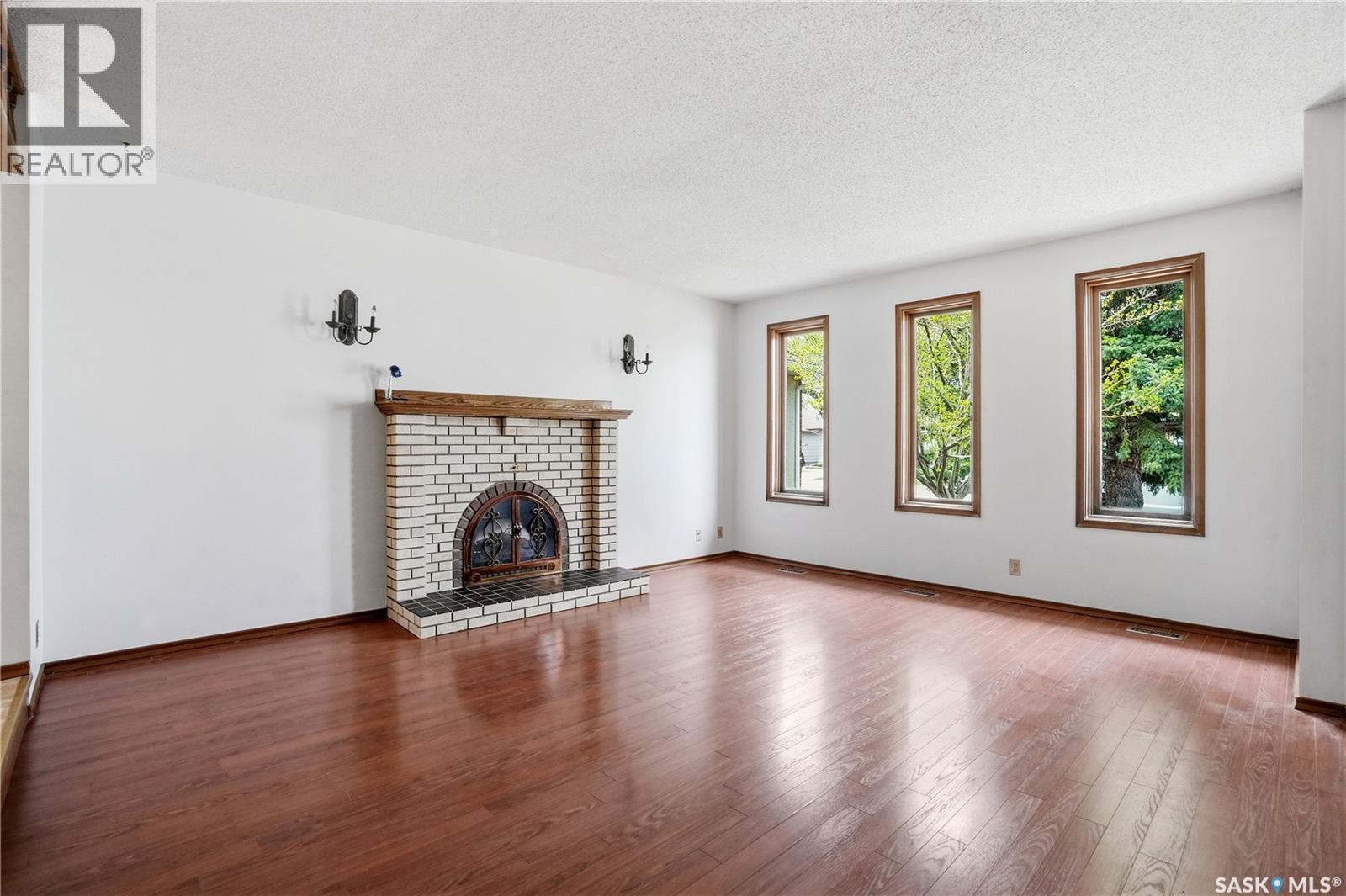 43 Springstein Avenue, Regina, SK - Indoor Photo Showing Living Room With Fireplace