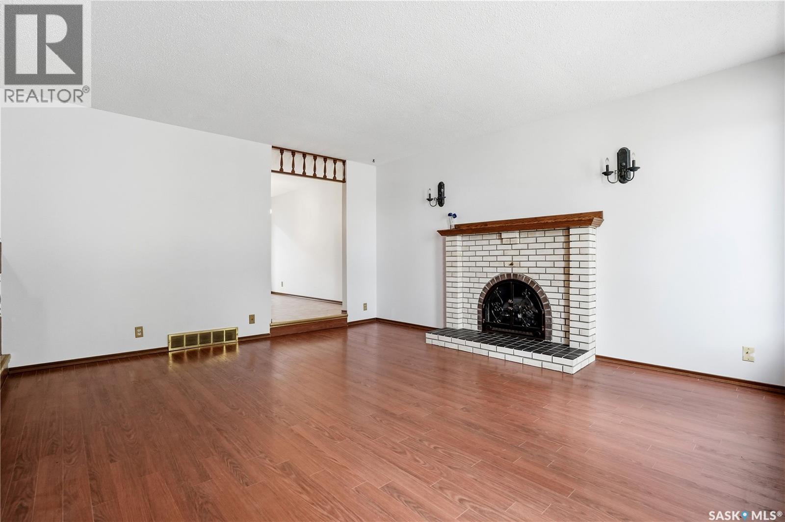 43 Springstein Avenue, Regina, SK - Indoor Photo Showing Living Room With Fireplace
