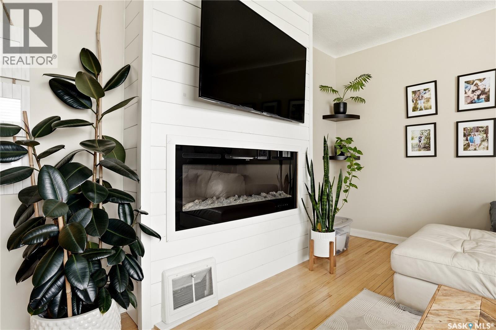 3410 Mccallum Avenue, Regina, SK - Indoor Photo Showing Living Room With Fireplace