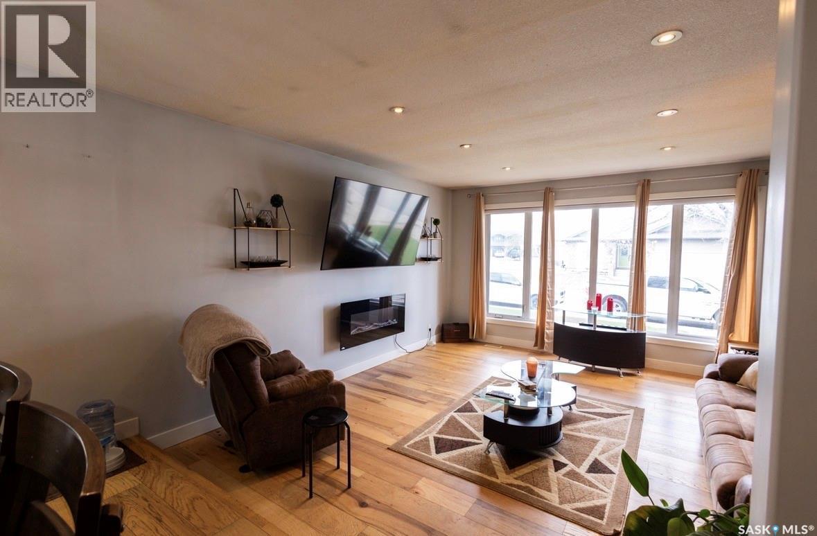 2258 Newis Bay E, Regina, SK - Indoor Photo Showing Living Room With Fireplace