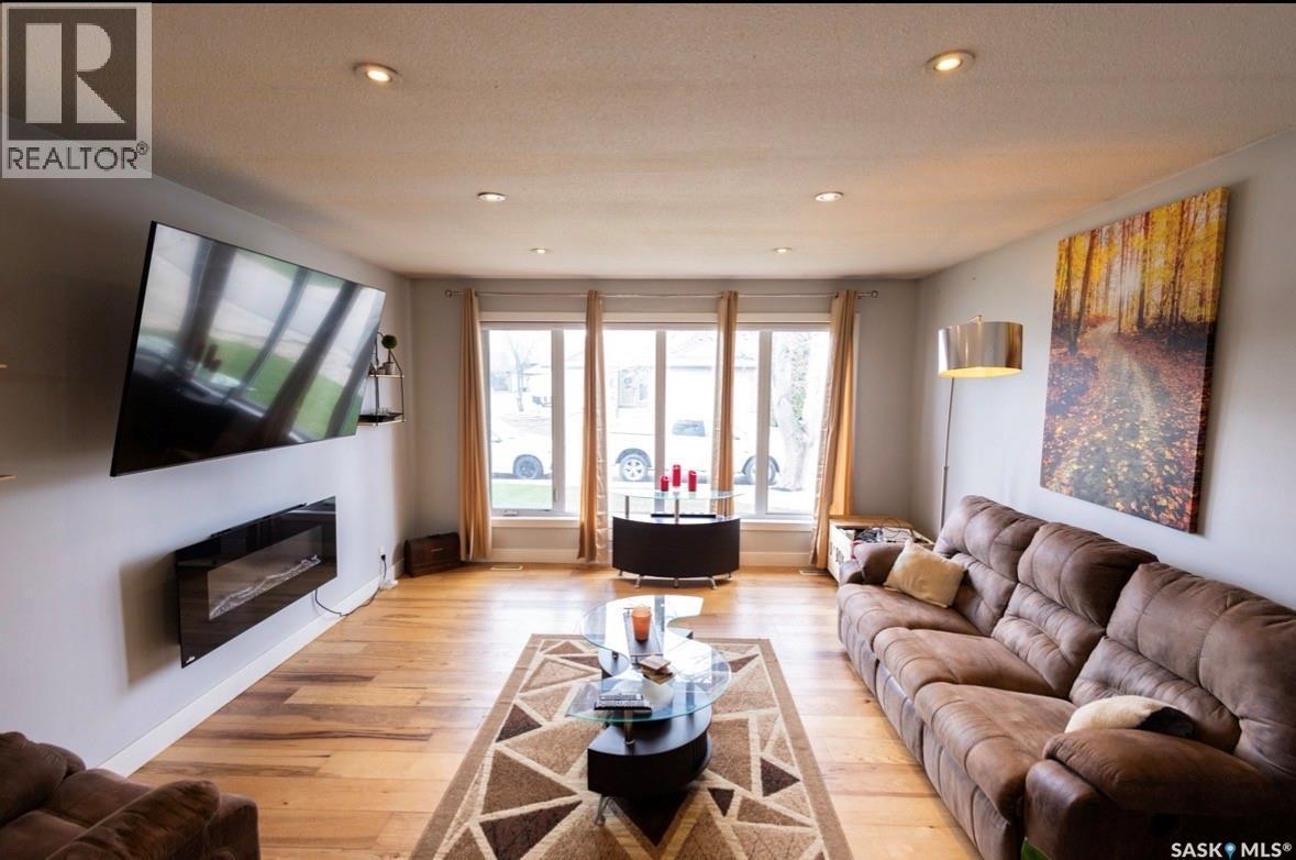 2258 Newis Bay E, Regina, SK - Indoor Photo Showing Living Room With Fireplace