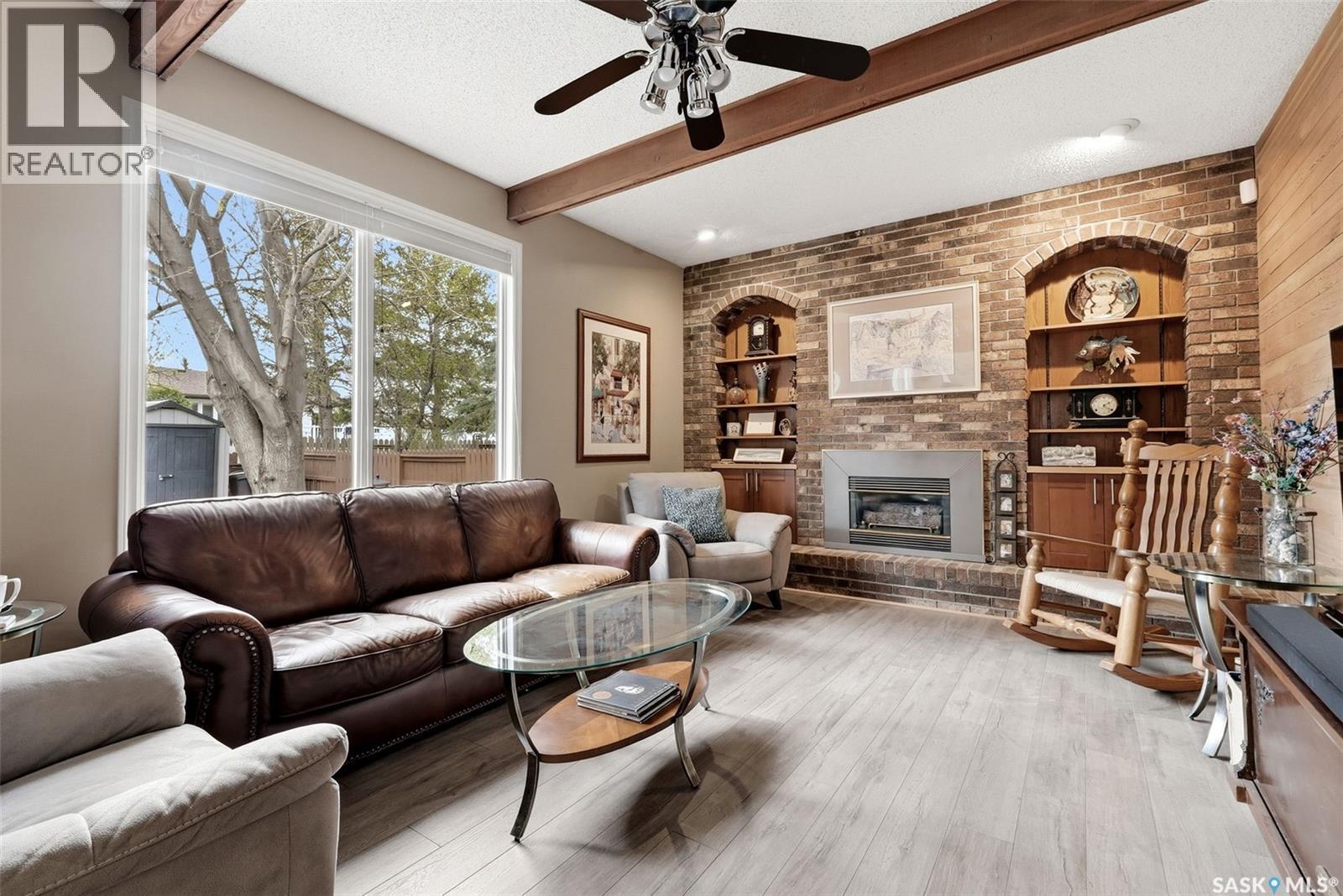 7 Cowie Road, Regina, SK - Indoor Photo Showing Living Room With Fireplace