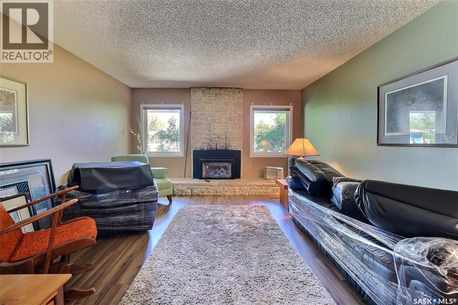 97 Compton Road, Regina, SK - Indoor Photo Showing Living Room With Fireplace