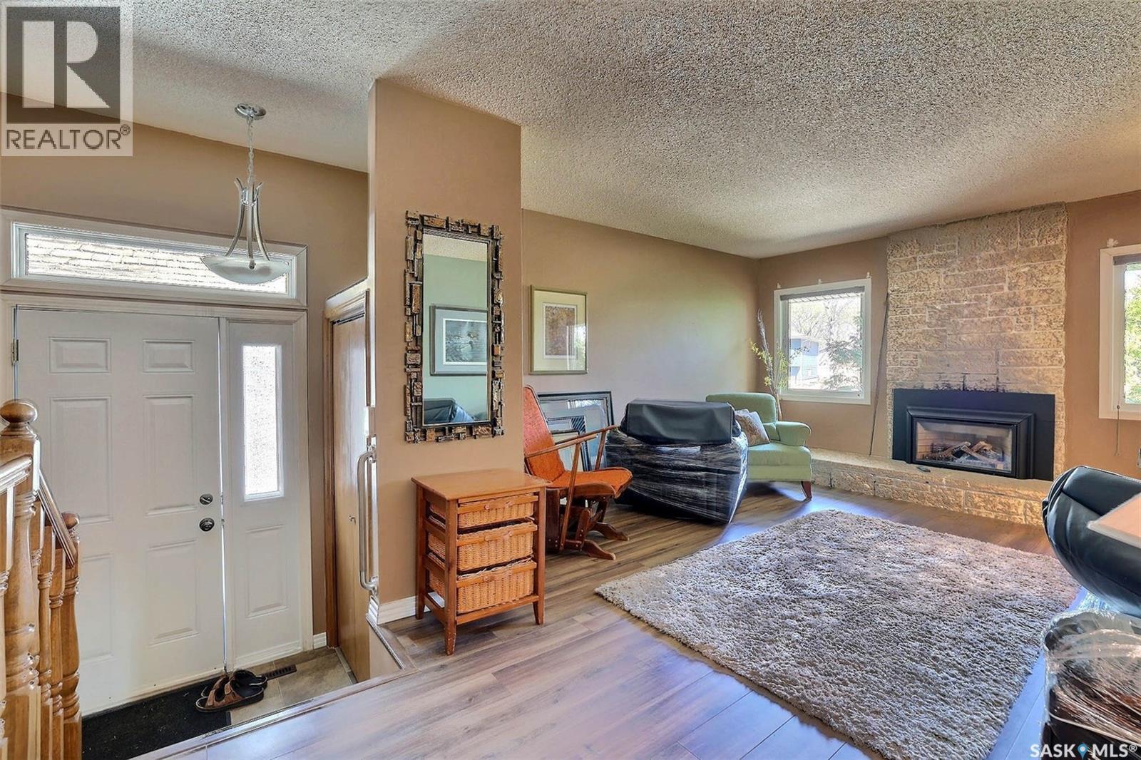 97 Compton Road, Regina, SK - Indoor Photo Showing Living Room With Fireplace