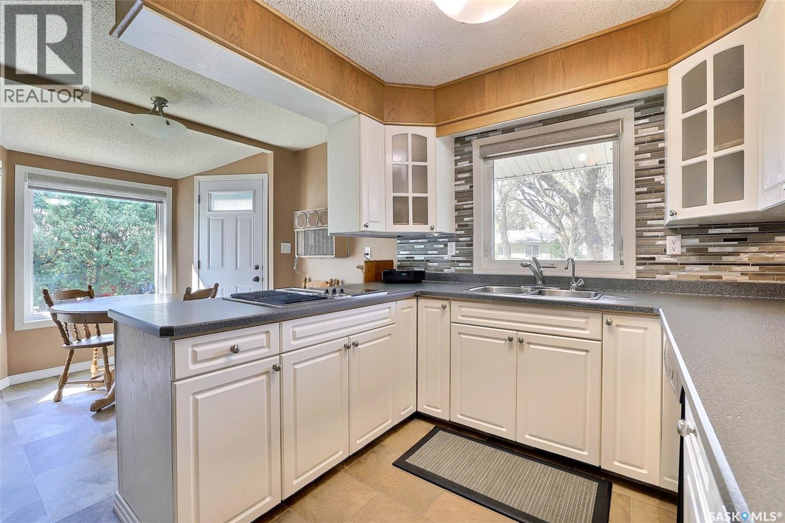 97 Compton Road, Regina, SK - Indoor Photo Showing Kitchen With Double Sink