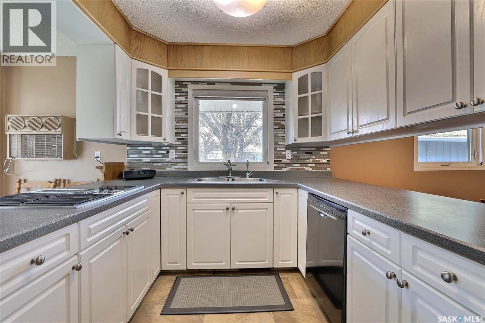 97 Compton Road, Regina, SK - Indoor Photo Showing Kitchen With Double Sink