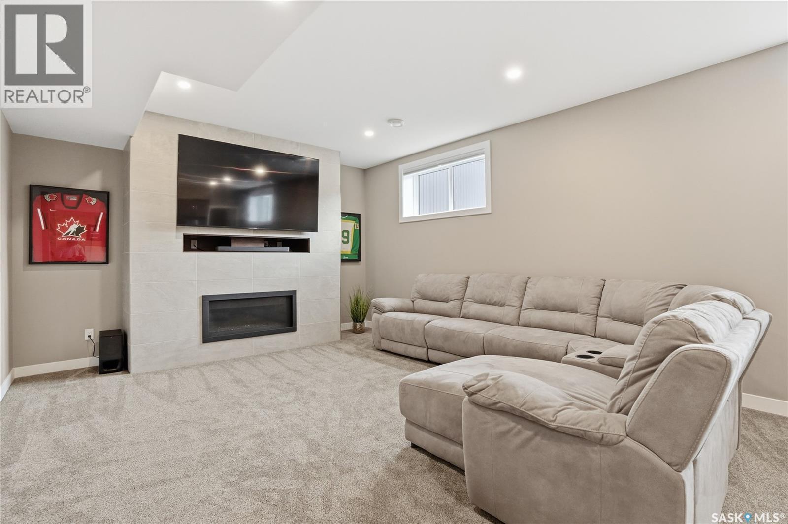 4264 Elderberry Crescent E, Regina, SK - Indoor With Fireplace
