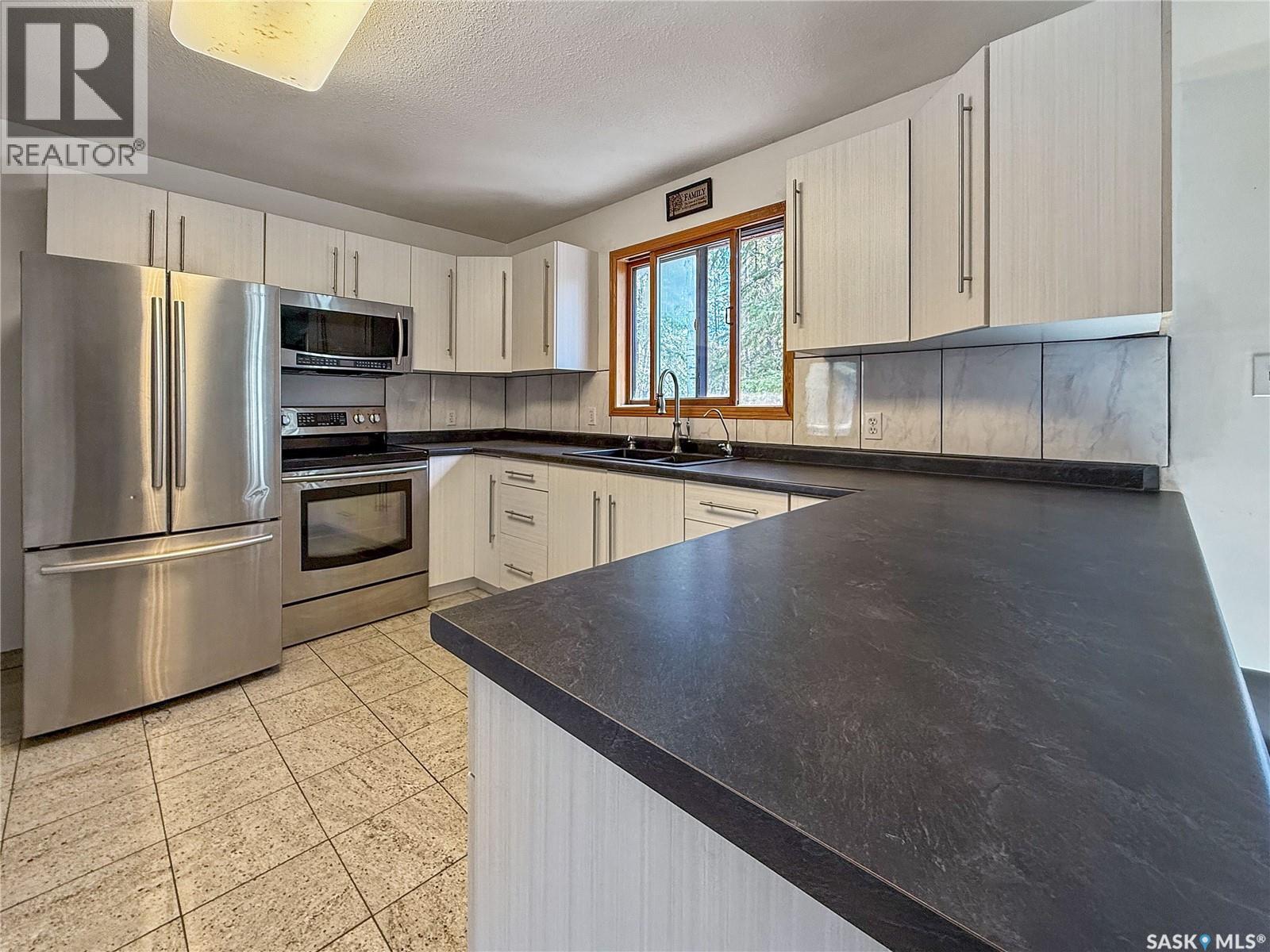 12 5Th Avenue, Candle Lake, SK - Indoor Photo Showing Kitchen With Double Sink