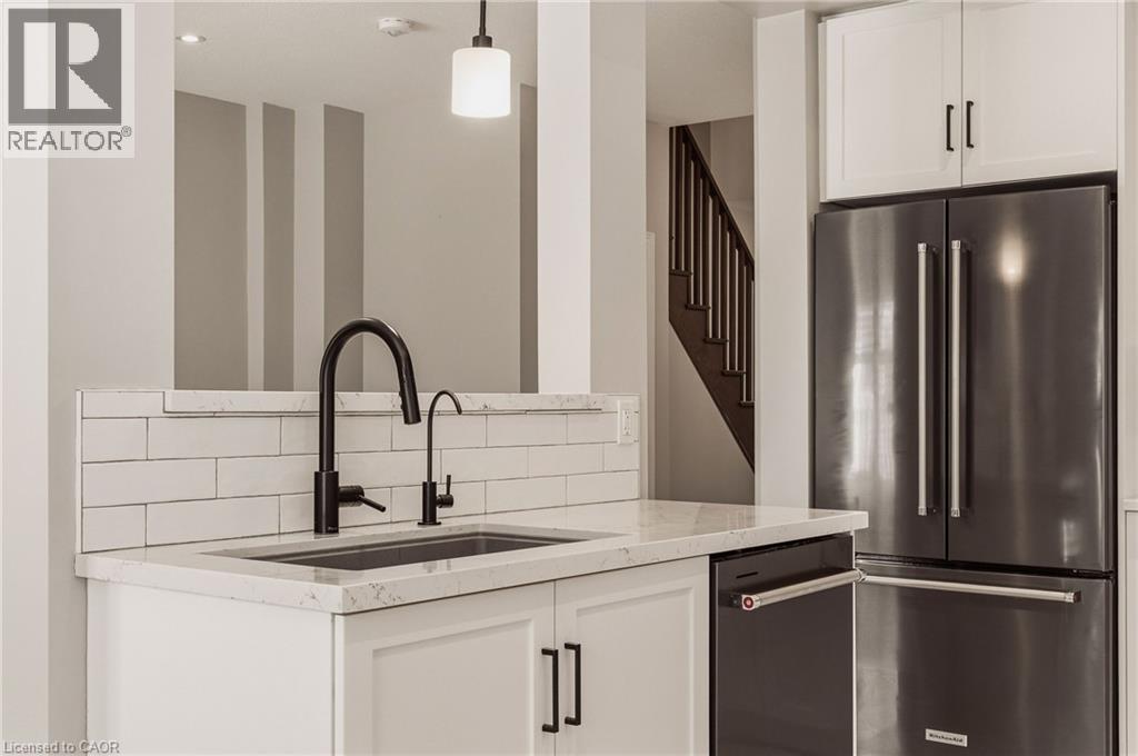 Cut-out facing the living room. - 81 Beasley Grove, Ancaster, ON - Indoor Photo Showing Kitchen With Upgraded Kitchen
