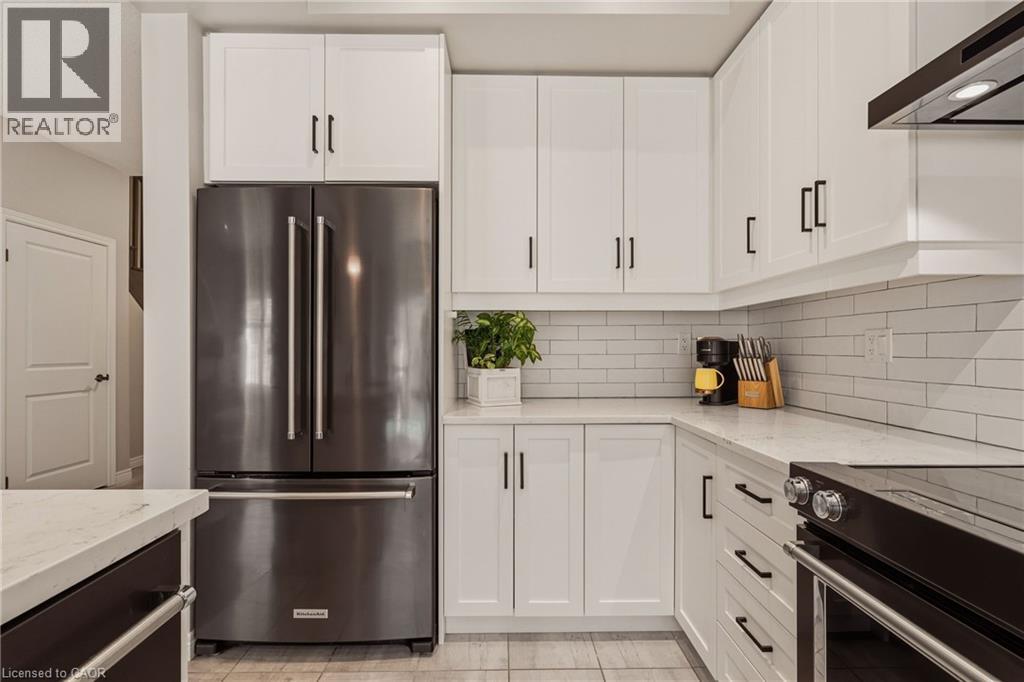 Stainless steel appliances included. - 81 Beasley Grove, Ancaster, ON - Indoor Photo Showing Kitchen