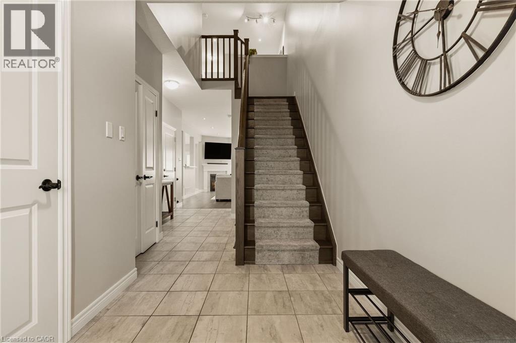 Upgraded staircase. - 81 Beasley Grove, Ancaster, ON - Indoor Photo Showing Other Room