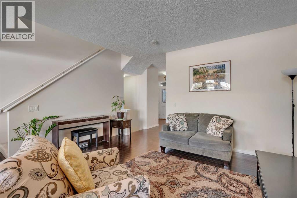 245 Auburn Crest Way Se, Calgary, AB - Indoor Photo Showing Living Room With Fireplace