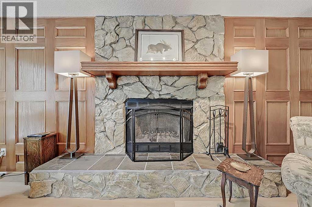 42 Sundown Close Se, Calgary, AB - Indoor Photo Showing Living Room With Fireplace