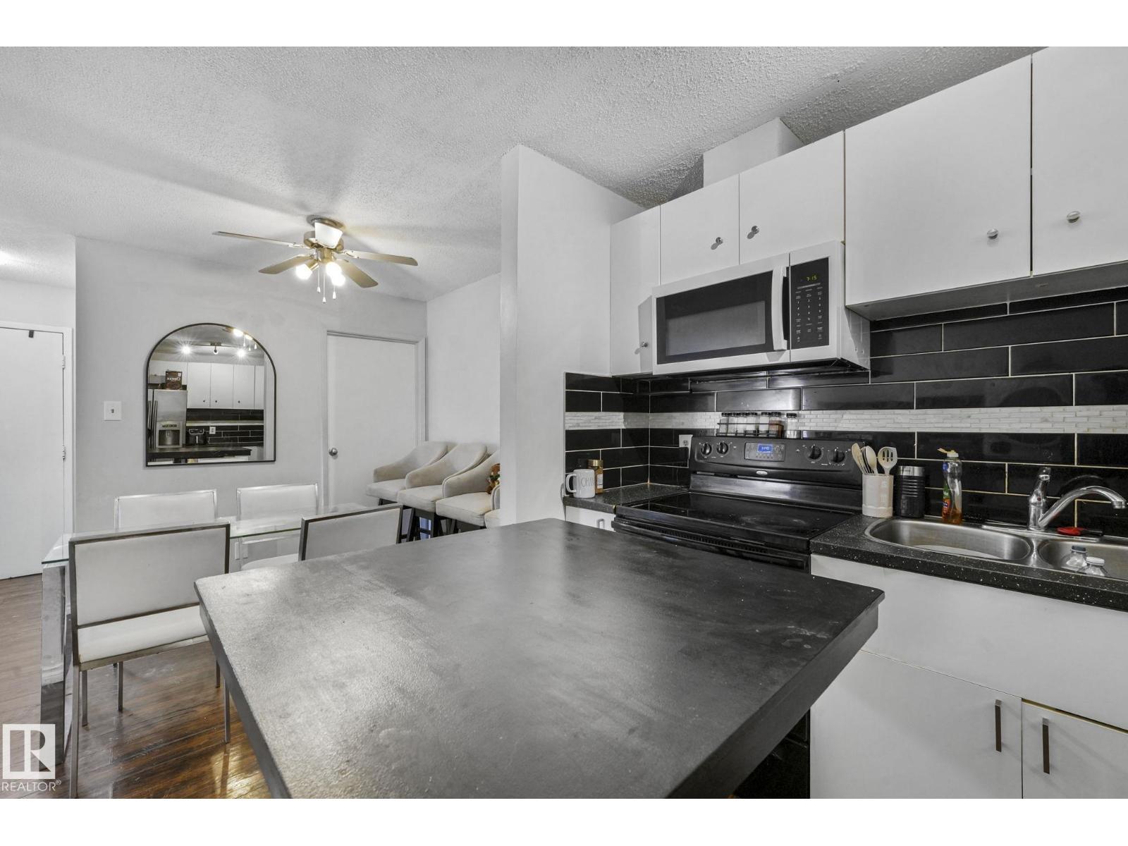 #A7 2808 116 St Nw, Edmonton, AB - Indoor Photo Showing Kitchen With Double Sink