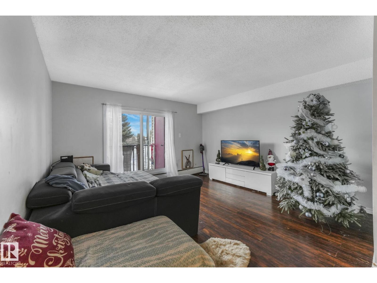 #A7 2808 116 St Nw, Edmonton, AB - Indoor Photo Showing Living Room