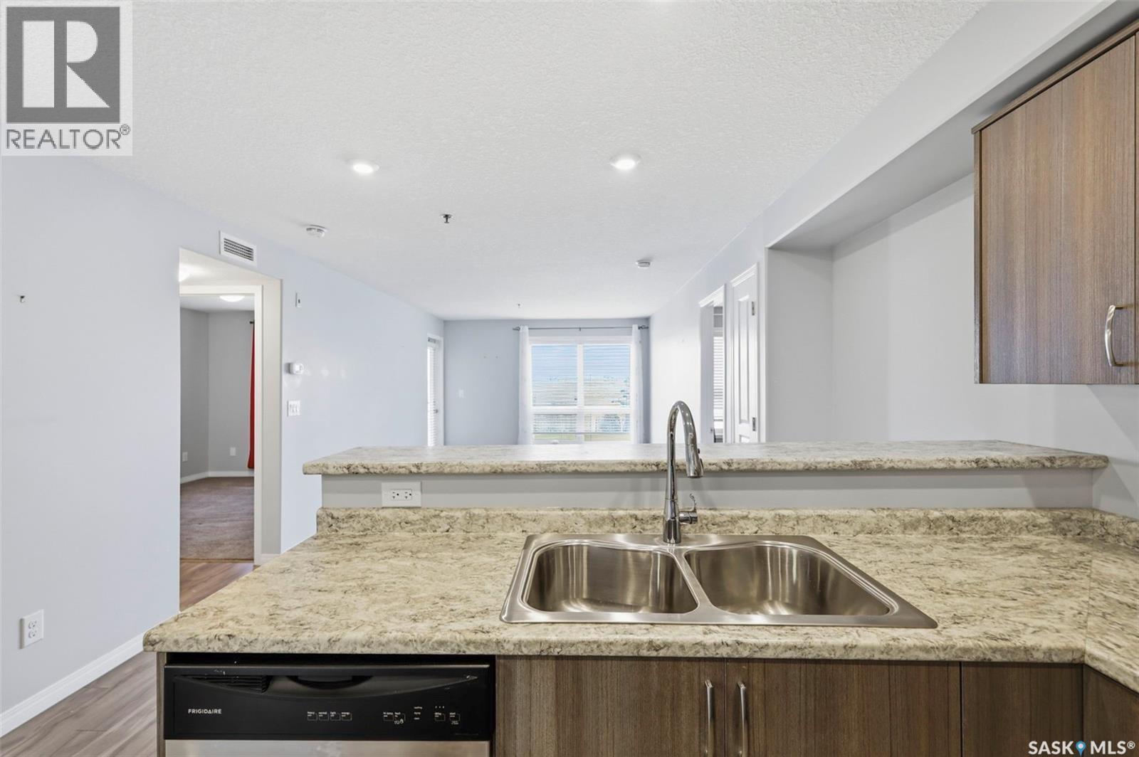 209 915 Kristjanson Road, Saskatoon, SK - Indoor Photo Showing Kitchen With Double Sink